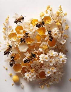 several bees are sitting on honeycombs with white flowers and yellow ones around them