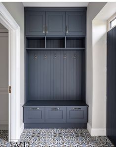 an image of a room with some cabinets and drawers on the wall in front of it