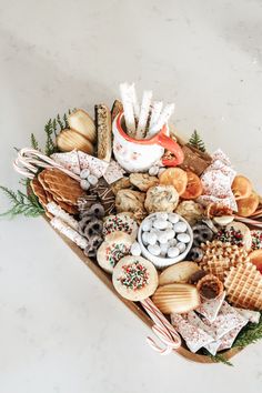 a platter filled with cookies, pretzels and other treats