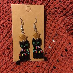 Sparkly Black Cat Wrapped In Christmas Lights With Star On Top Of Its Head New/ Unused Charm Material: Acrylic Approximately 2.75 Inches Long From The Top Of The Hook To The Bottom Of The Charm Black Cat Christmas, Cat Christmas, The Hook, Christmas Earrings, Earrings Color, Christmas Cats, Christmas Lights, Black Cat, Women Jewelry