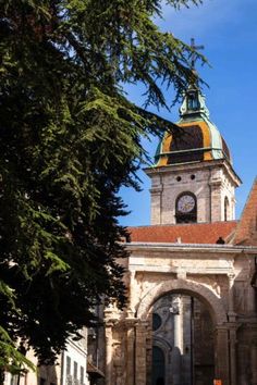 an old building with a clock on the tower