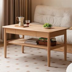 a coffee table with some fruit on it and a cup sitting on top of it