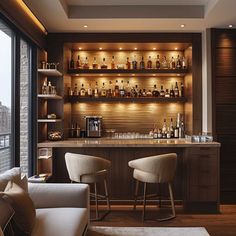 a bar with two chairs and some bottles on the shelves in front of it that are filled with liquor