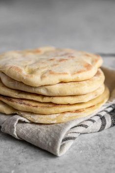 a stack of flat bread on top of a cloth