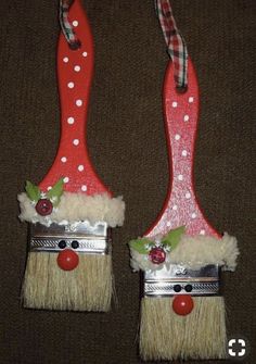 two red and white christmas decorations with santa hats on them, one has a nose