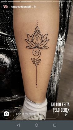 a woman's leg with a tattoo design on the lower half of her leg