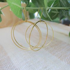 Our Large Double Circle Earring is the perfect modern hoop that works with every look and is perfect to wear as your daily earring. They are big enough to be noticeable, but lightweight enough to wear all day long without ear fatigue. 40mm & 20mm circles Closed short kidney style brass wire 2.5″ inch style earring Available in brass or silvertone Hoop Earrings Aesthetic, Double Circle Necklace, Boho Hoop Earrings, Artisan Jewelry Handmade, Double Hoop Earrings, Earrings Aesthetic, Circle Necklace, Circle Earrings, Gift Collections