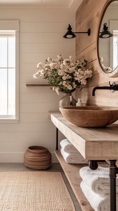 a bathroom with a sink, mirror and rug