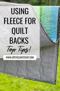 a quilt with the words using fleece for quilt backs top tips on green grass