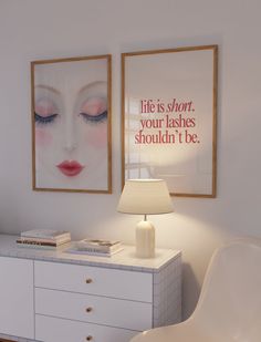 two framed pictures hang on the wall above a white dresser with a lamp and chair