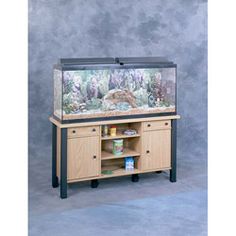 a fish tank sitting on top of a wooden cabinet