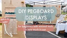 an outdoor display with some pictures on it and text that reads diy pegboard displays for beginners with minimal tools + how much it cost