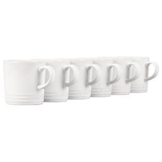 five white coffee mugs lined up in a row