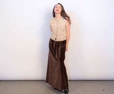 Vintage 60s velvet maxi skirt. Unique high-waisted velvet skirt in a great chocolate brown. Gathered waist with a voluminous full silhouette. Maxi length. Cut from soft cotton velvet fabric. Back button and zipper fastening. Unlined. We kindly ask that you please view all measurements for comparison so you can get your desired fit. * Brand: Prestige * Decade: 1960s, early 70s  * Fabric: Cotton * Lining: Unlined * Color: Chocolate Brown C O N D I T I O N * Excellent vintage condition * Minimal pr Velvet Maxi Skirt, 70s Fabric, Minimal Dress, Full Maxi Skirt, Velvet Maxi, Color Chocolate, Brown Velvet, Velvet Skirt, Puff Sleeve Top