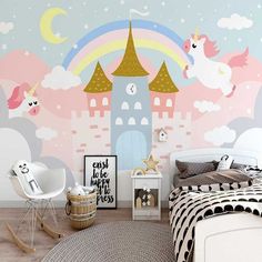 a child's bedroom decorated in pastel colors with unicorns and castle wallpaper