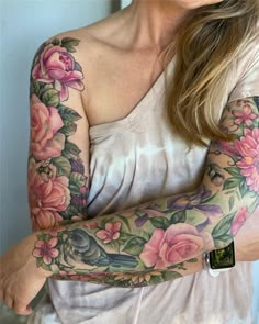 a woman with tattoos on her arms and arm