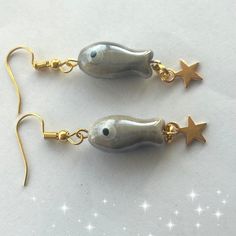 Japanese mini grey koi fish earrings. Cute ceramic bead koi fish carp star earrings. The koi fish has long been known as a lucky symbol of good fortune.  These earrings feature a unique design that is my own design making them a one-of-a-kind gift for your loved ones. The cute ceramic fish on the earrings are seen swimming upstream against the current, symbolizing perseverance and strength. The earrings also come with gold or silver plated hooks that add a touch of elegance to the design. Measur Japanese Koi Fish, Zen Gifts, Fish Symbol, Fish Earrings, Lucky Symbols, Carpe Koi, Money Success, Intense Love, Japanese Koi