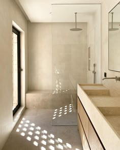 a bathroom with two sinks and a large mirror