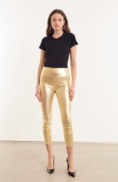 Our classic cropped leggings will quickly become an essential part of your wardrobe. Made from our signature French stretch-leather, they feel like a second-skin due to their extreme breathability technology, and can be worn year-round. Fitted with our high-rise Japanese elastic waistband, they easily conform to your body for a figure-sculpting fit. As the cropped version of our Ankle Skinny Leggings, this style is a great option for petite figures, tucking into boots, and showing off those new shoes.  COLOR: Metallic Gold Shoes Color, Capri Leggings, Gold Leather, Leather Leggings, Second Skin, Cropped Leggings, Metallic Gold, New Shoes, Feel Like