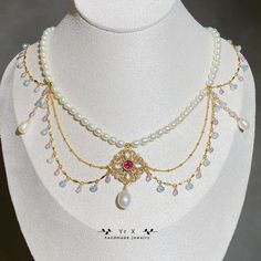 "Material: Natural White Freshwater Pearl                  Natural Rainbow Moonstone                  Natural Pyrope Garnet                  Natural Amethyst                  Natural Aquamarine                  14K Gold Filled            Size: Pearl 4.5-5mm,6.5-8.5mm             Moonstone 3*6mm                 Pyrope Garnet 6mm             Amethyst 3mm             Aquamarine 4-4.5mm Necklace length: 15\" with 3\" extender chain (adjustable 15\"-18\")                                                      White Pearl Quality:origin China,strong light,basically flawless This amazing necklace is inspired of the Victorian era and the vintage great necklaces. Fascinated necklace for your special day. I can only imagine this on some special girl's neck on her wedding day. Let your imagination run Baroque Necklaces With Historical Design For Wedding, Baroque Necklace With Historical Design For Weddings, Baroque Wedding Necklace With Historical Design, Baroque Historical Design Necklace For Wedding, Baroque Pearl Necklace For Wedding, Pearl White Gemstone Necklace For Wedding, Heirloom Pearl Pendant Necklace For Wedding, Heirloom Baroque Jewelry For Weddings, Handmade Baroque Necklace For Wedding