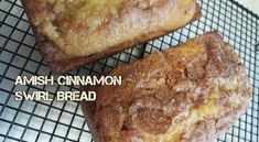 two pieces of bread sitting on top of a cooling rack with words over it that read, amish cinnamon swirl bread