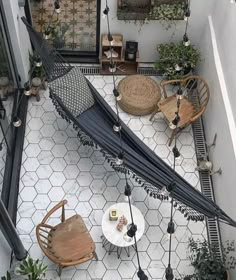 an overhead view of a patio with tables and chairs