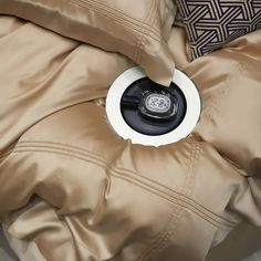 the inside of a jacket with a black and white button on it's center