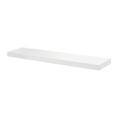 a white shelf that is on top of a wall and has no one in it