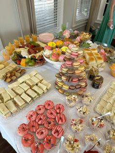 an assortment of pastries and desserts on a table