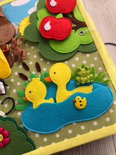 a close up of a child's play mat with animals and birds on it