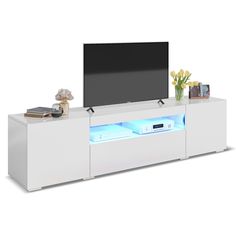 a white entertainment center with blue lights on the side and a flat screen tv mounted above it