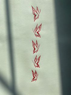 some red ink on white paper that has been drawn