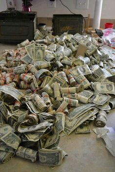 a pile of money sitting on top of a floor