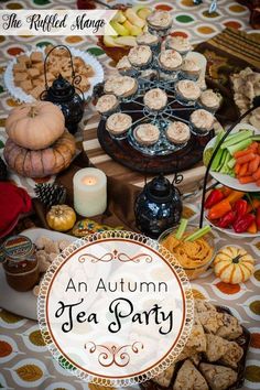 an autumn tea party with lots of food on the table and in front of it