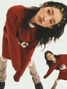 two young women in red sweaters posing for the camera