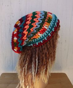 "OOAK handmade crochet beanie, with random colored zigzagging stripes. \"Eclectic Mix\" contains blues, teal, green and variegated yarns. The length and width is suitable for dreadlocks (short to medium). Width at brim 20\", stretches to 25\", cinches smaller with drawstring Length from crown to rim 10,5\"  Widest point across 11\" All hypo-allergic acrylic yarn.  I suggest hand-washing and flat-drying, care suggestions come in each package." Crochet Hippie Hat, Casual Beanie For Festivals, Bohemian Adjustable Beanie For Fall, Bohemian Slouchy Crochet Beanie, Multicolor Handmade Slouchy Hats, Handmade Multicolor Slouchy Hat, Slouchy Crochet Bohemian Beanie, Slouchy Bohemian Crochet Beanie, Slouchy Multicolor Beanie Hat