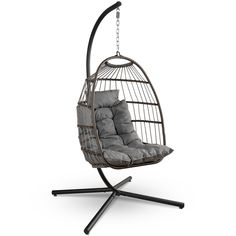 a swing chair with grey cushions on it