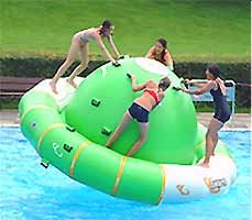 three people are playing on an inflatable raft