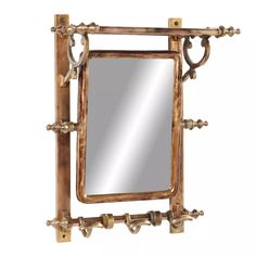 a mirror that is sitting on top of a wooden frame with metal fittings around it