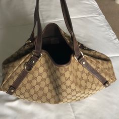 Beautiful Comfortable Authentic Used Gucci Hobo Bag. Used With Love. Gold Tone Hardware. See Pics For Wear Marks. Purchased At Neiman Marcus Boston. Gucci Tote Shoulder Bag With Gold-tone Hardware, Luxury Pre-owned Brown Bag, Gucci Brown Top Handle Shoulder Bag, Pre-owned Designer Brown Bags, Designer Pre-owned Shoulder Bag, Gucci Brown Monogram Canvas Shoulder Bag, Brown Gucci Satchel With Gold-tone Hardware, Gucci Brown Satchel With Gold-tone Hardware, Gucci Brown Shoulder Bag Satchel