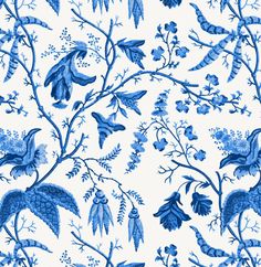 a blue and white wallpaper with birds, flowers and leaves on the bottom half of it