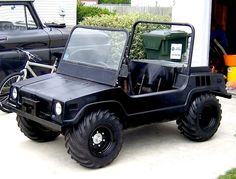 a black jeep parked in front of a house