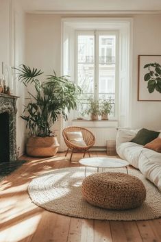 a living room filled with furniture and a fire place next to a large potted plant