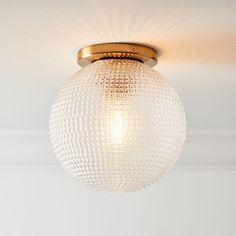 a ceiling light with a glass ball on it