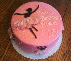 a pink birthday cake with a ballerina on it