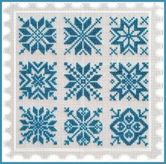 a cross stitch pattern with blue snowflakes on the front and back of it