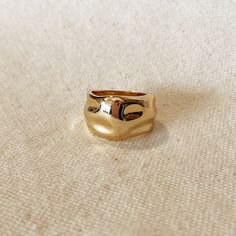 This elegant 18K gold-filled wide band ring features a striking crumpled design that will make a statement. This chunky and modern piece is perfect for gifting or treating yourself to a little luxury. Its exclusive design evokes high art and fashion, making it the ideal choice for those who appreciate the finer things in life. 13mm wide top wavy band ring. Metal: 18k Gold filled Available sizes: 6,7,8 and 9 Weight: 4.6 grams Hypoallergenic Waterproof Handcrafted in Brazil Would you like to becom Chunky Gold Rings, Ring Leader, Ring Inspo, Wide Band Ring, Art And Fashion, Gold Filled Ring, Wide Band Rings, Meow Meow, High Art