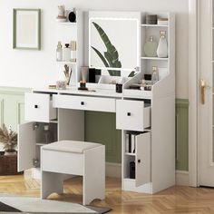 a white dressing table with mirror and stool