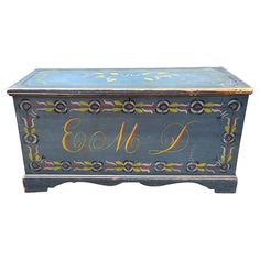 an ornate blue chest with gold lettering on it