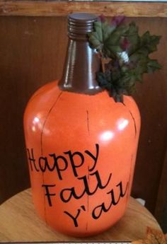 an orange pumpkin shaped bottle with the words happy fall y'all written on it